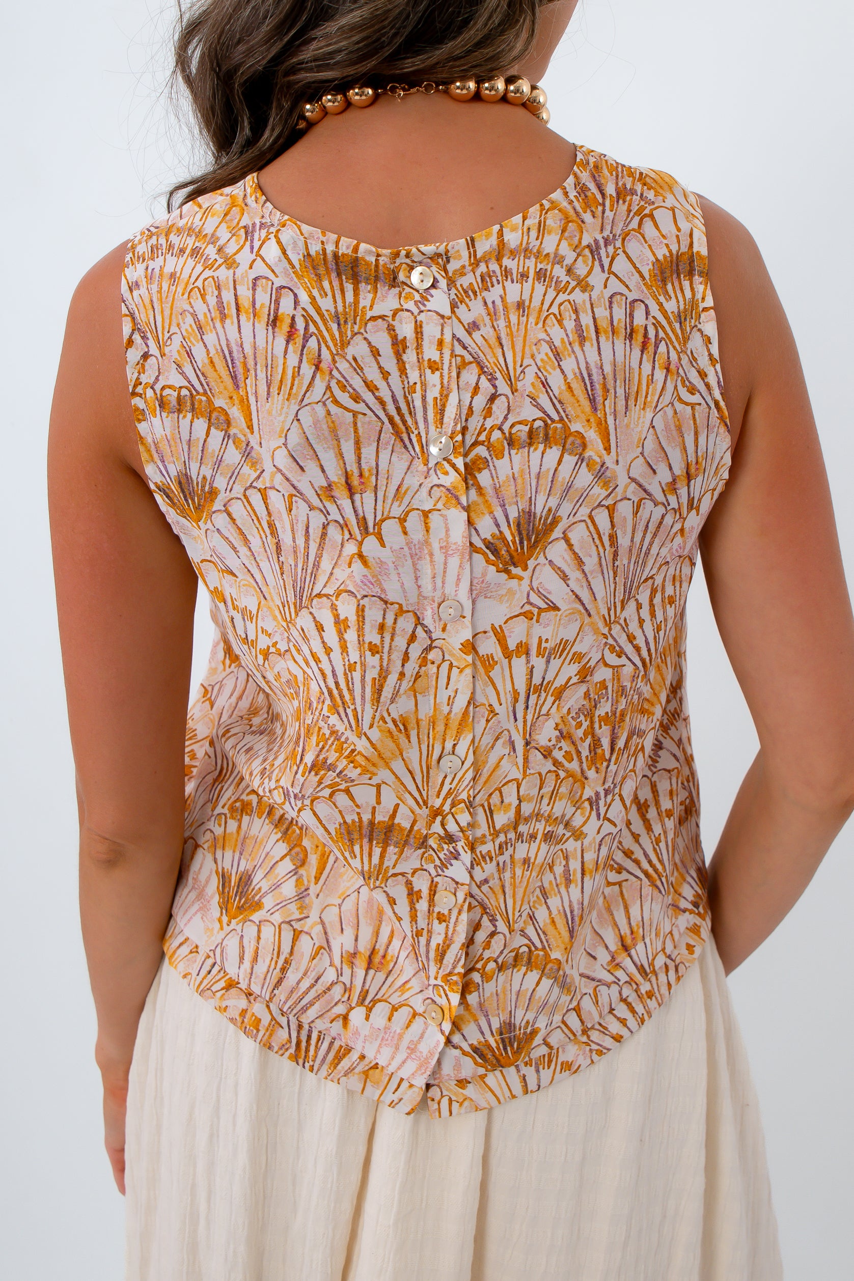 High neck sleeveless button down back blouse with shell pattern for summer workwear, summer vacations, tropical vacations, beach look
