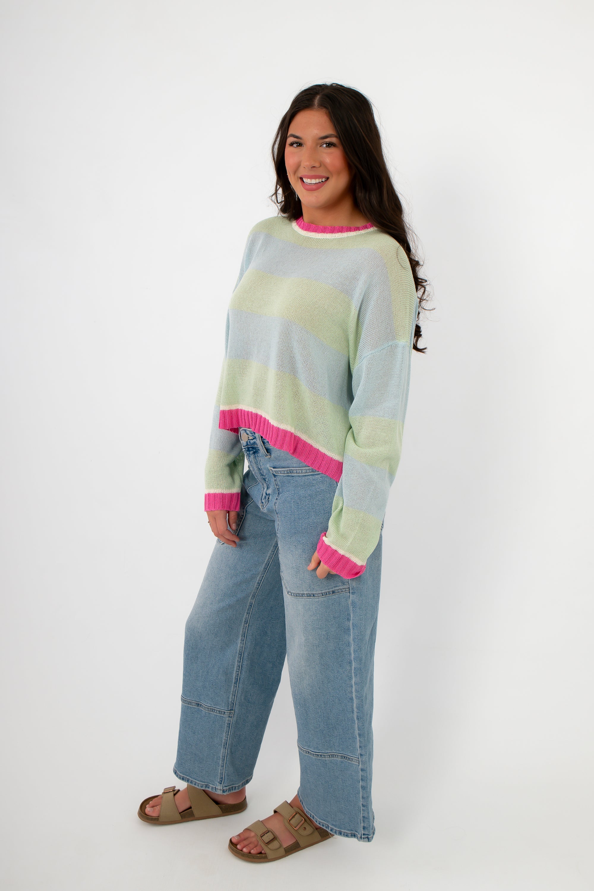 Cabana Stripe Lightweight Sweater styled with wide-leg denim and sandals, showcasing relaxed fit and pastel color blocking. Perfect for spring layering.