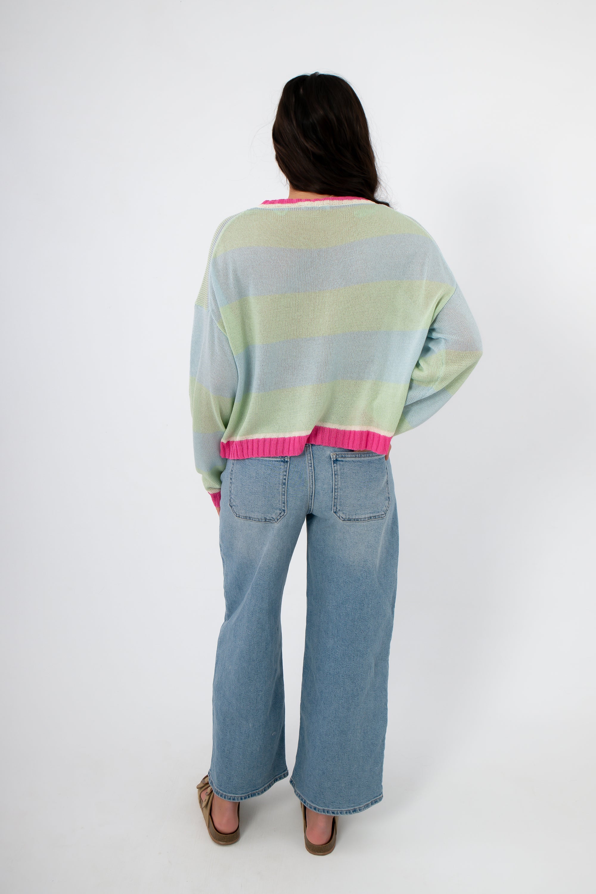 Back view of Cabana Stripe Lightweight Sweater with mint and sky blue stripes and pink hem, highlighting breathable knit fabric and casual fit.