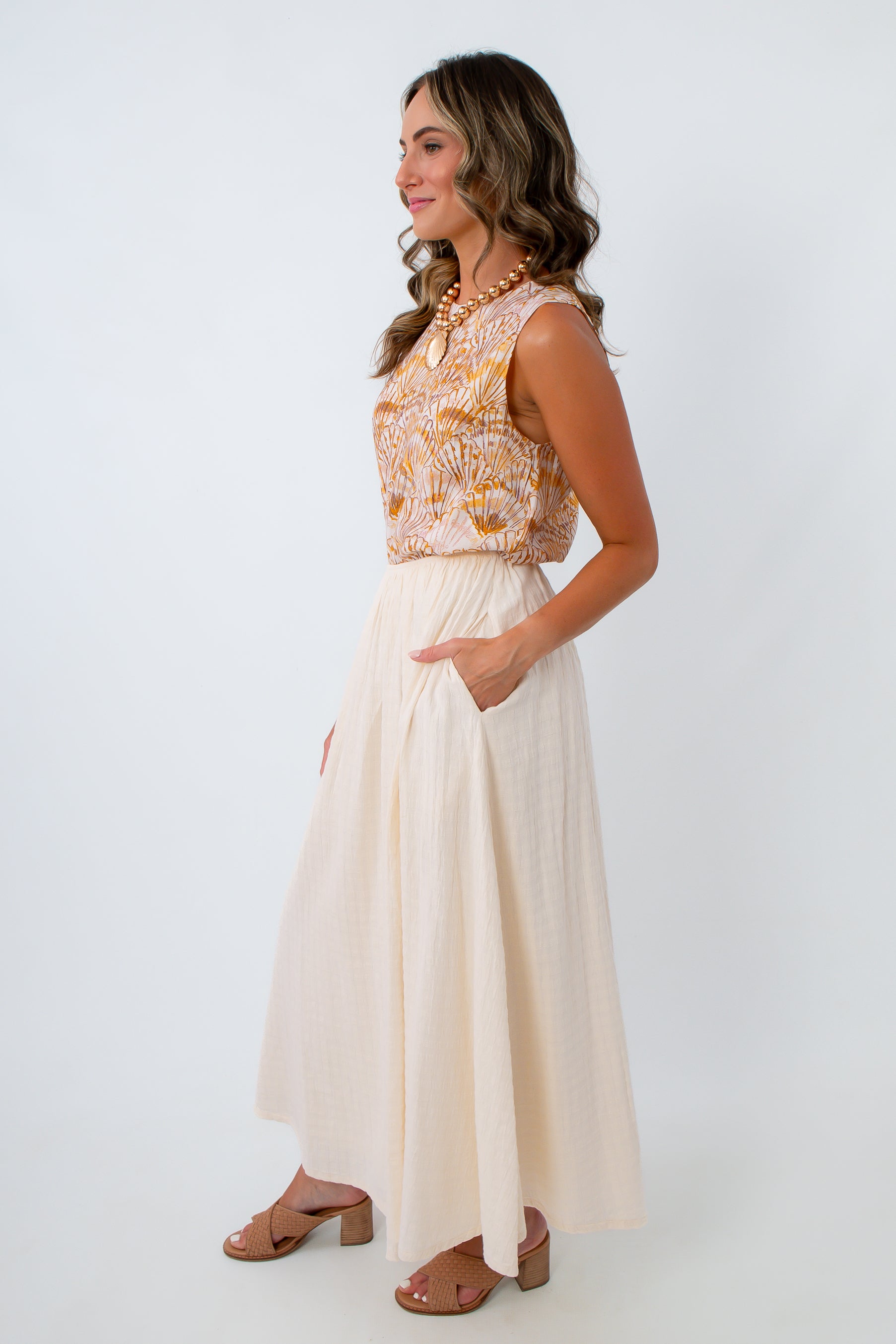 Fully lined cotton midi skirt with elastic waist and side pockets paired with coastal seashell tank for summer