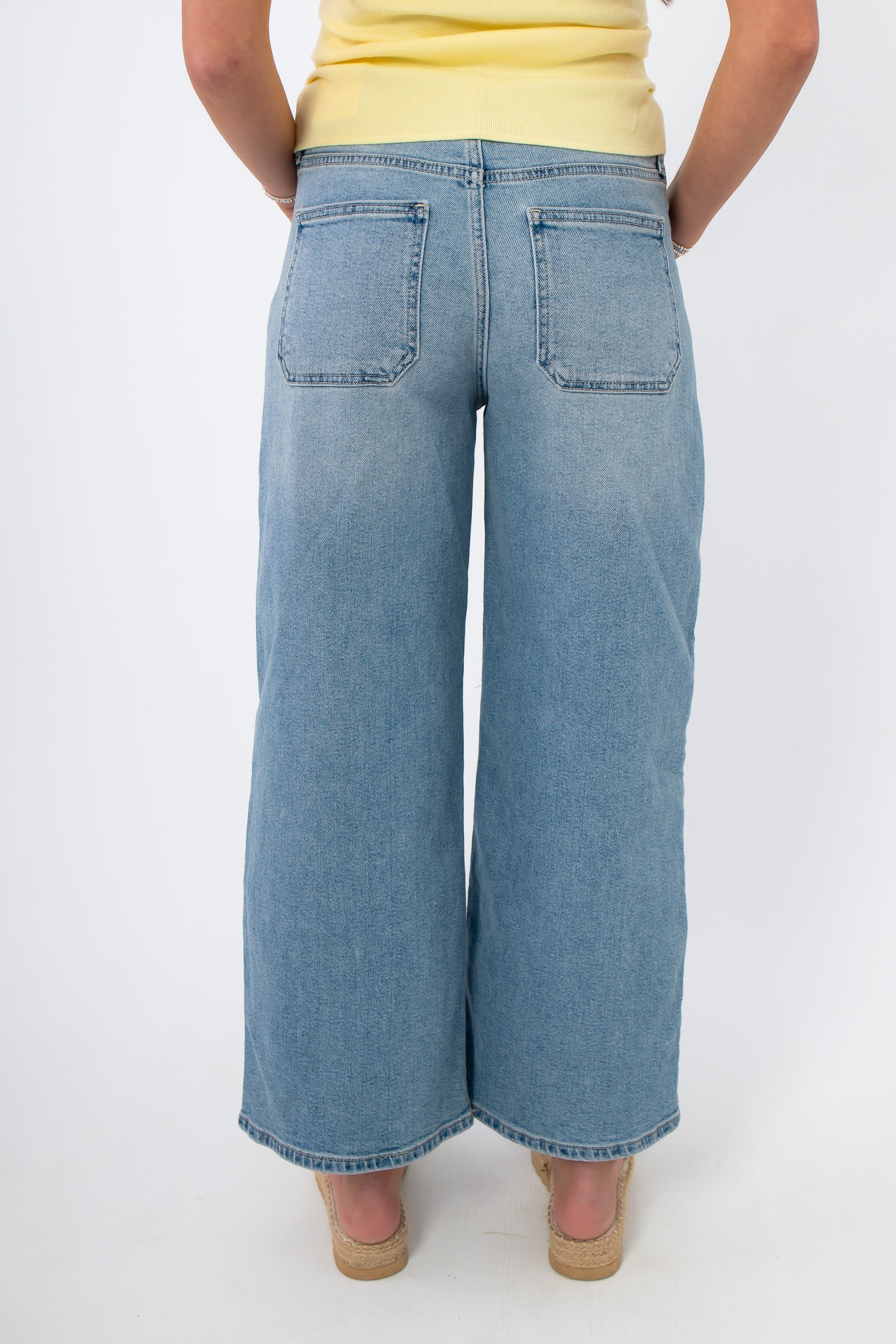 Back view of Kimberly Light Denim Cropped Wide Leg Jean featuring classic rear patch pockets and relaxed wide leg cut.