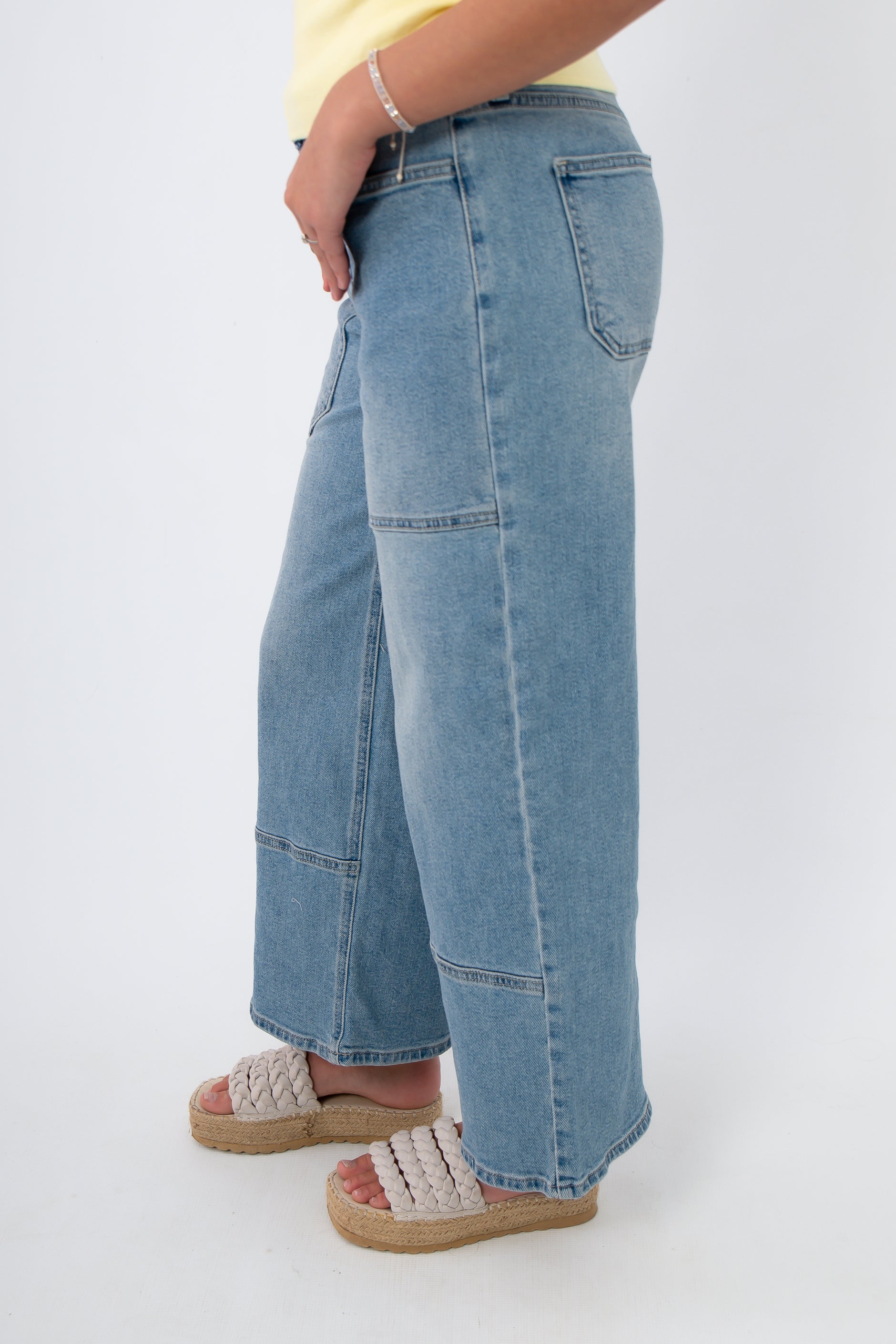 Side view of Kimberly Light Denim Cropped Wide Leg Jean showing wide leg silhouette and ankle-length crop in light wash denim.