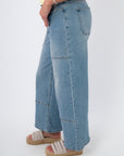 Side view of Kimberly Light Denim Cropped Wide Leg Jean showing wide leg silhouette and ankle-length crop in light wash denim.