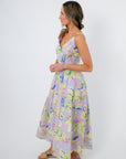 Palm Springs Lavender Printed Midi Dress with floral pattern, featuring a fitted bodice and flowy skirt, ideal for summer weddings or vacations.