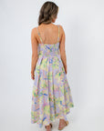 Back view of Palm Springs Lavender Printed Midi Dress showing smocked bodice and adjustable straps, perfect for spring and summer occasions.