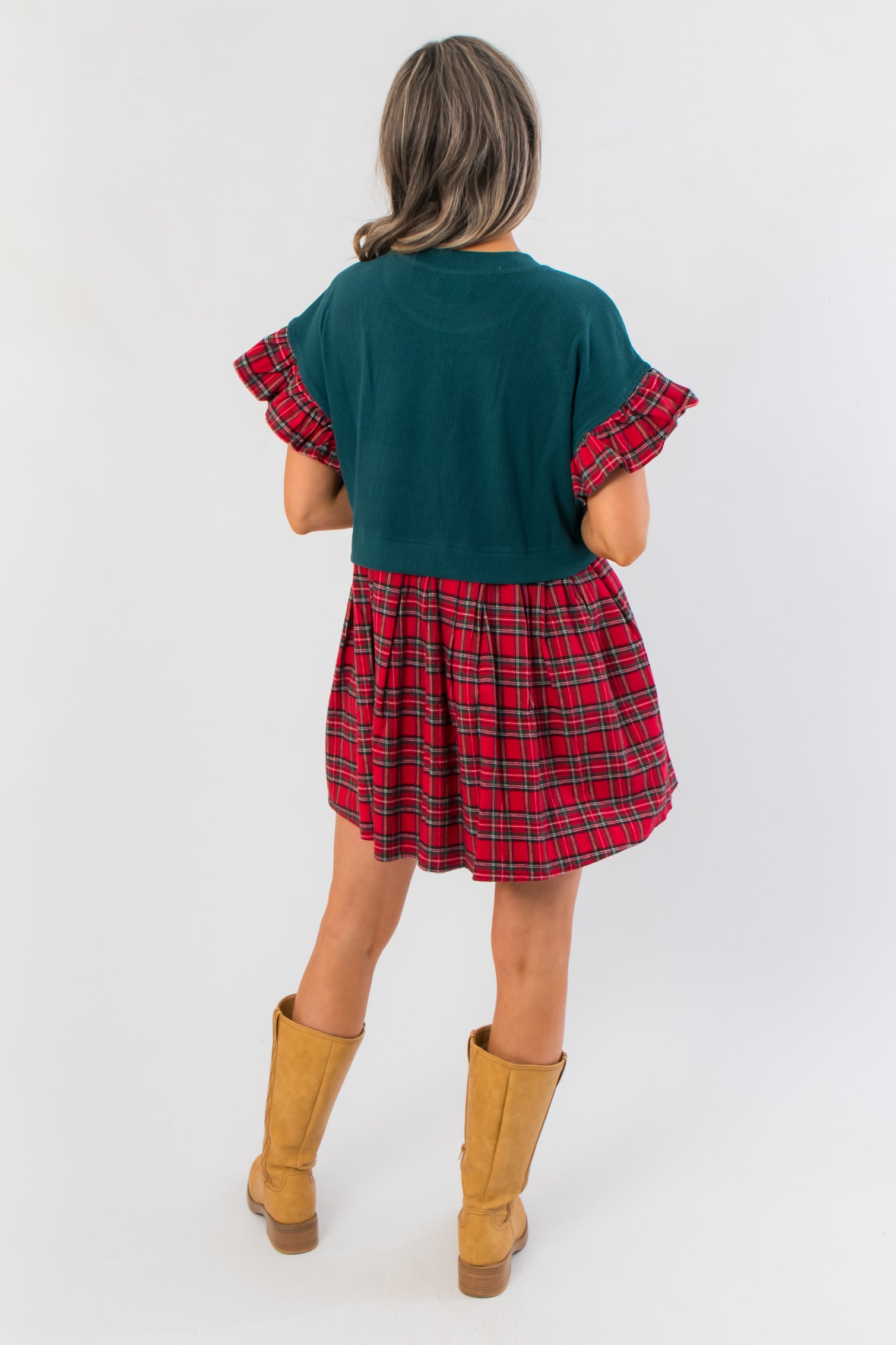 Back view of Mistletoe Moment Tartan Plaid Babydoll Dress showing green bodice and red plaid skirt, cozy holiday dress for Christmas events.