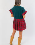 Back view of Mistletoe Moment Tartan Plaid Babydoll Dress showing green bodice and red plaid skirt, cozy holiday dress for Christmas events.