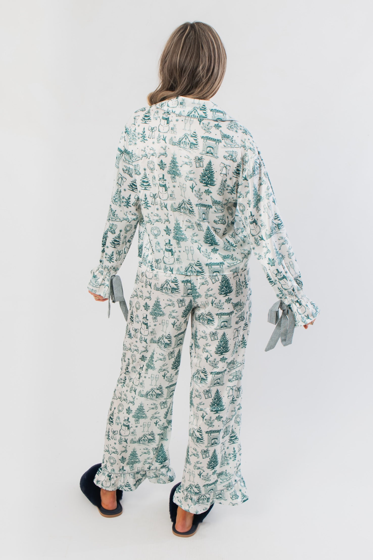 Back view of Heritage Holiday Toile Green Pajama Set featuring green holiday-themed toile print, ruffle hems, and relaxed fit for cozy lounging.