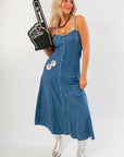 Z Supply Indigo Angel Eyes Denim Midi Dress with sweetheart neckline, button front, and adjustable straps, styled with silver boots for gameday.