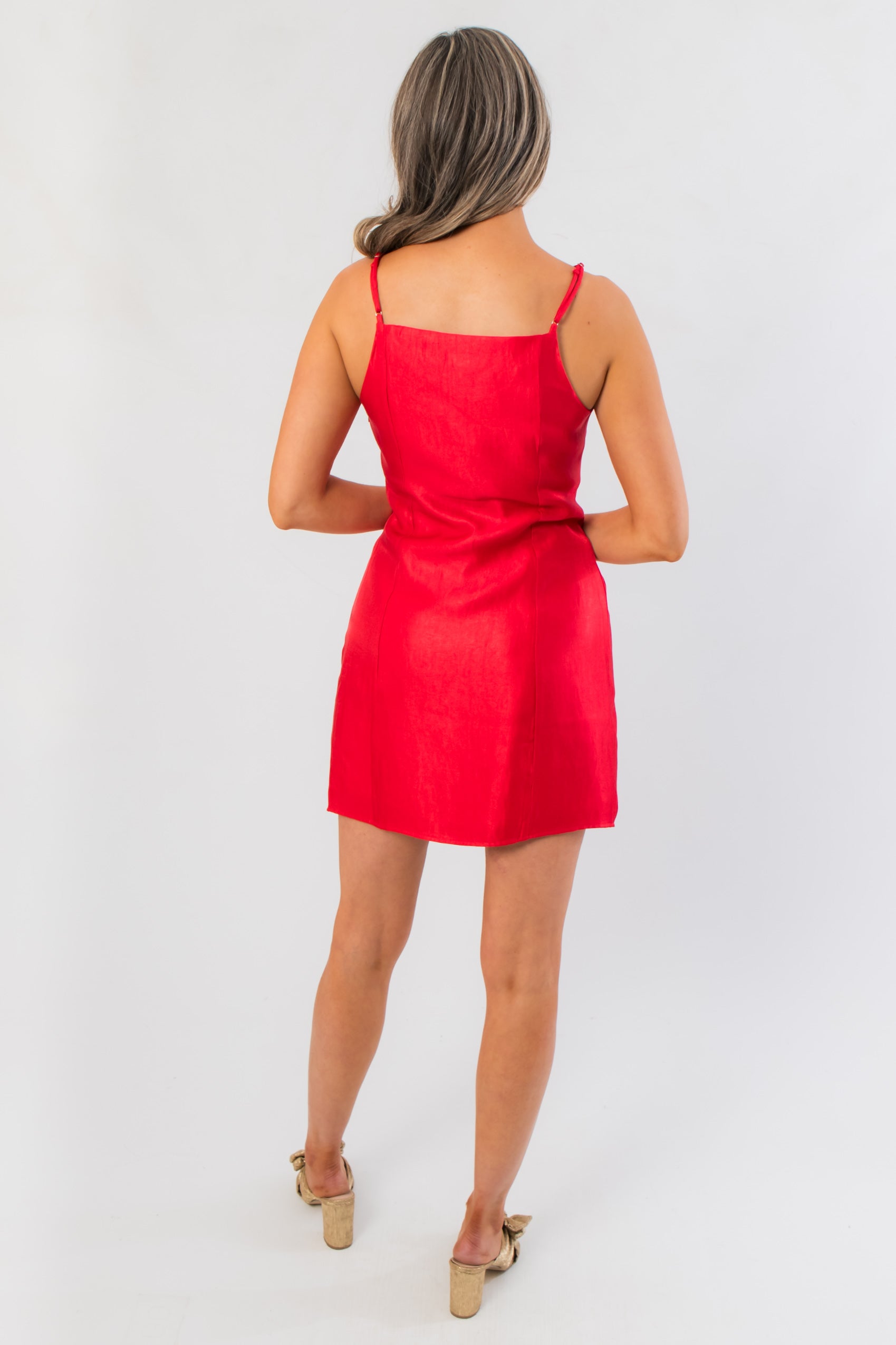 Back view of Noelle Red Bow Square Neck Mini Dress with adjustable straps and clean lines, a chic choice for holiday and occasion wear.