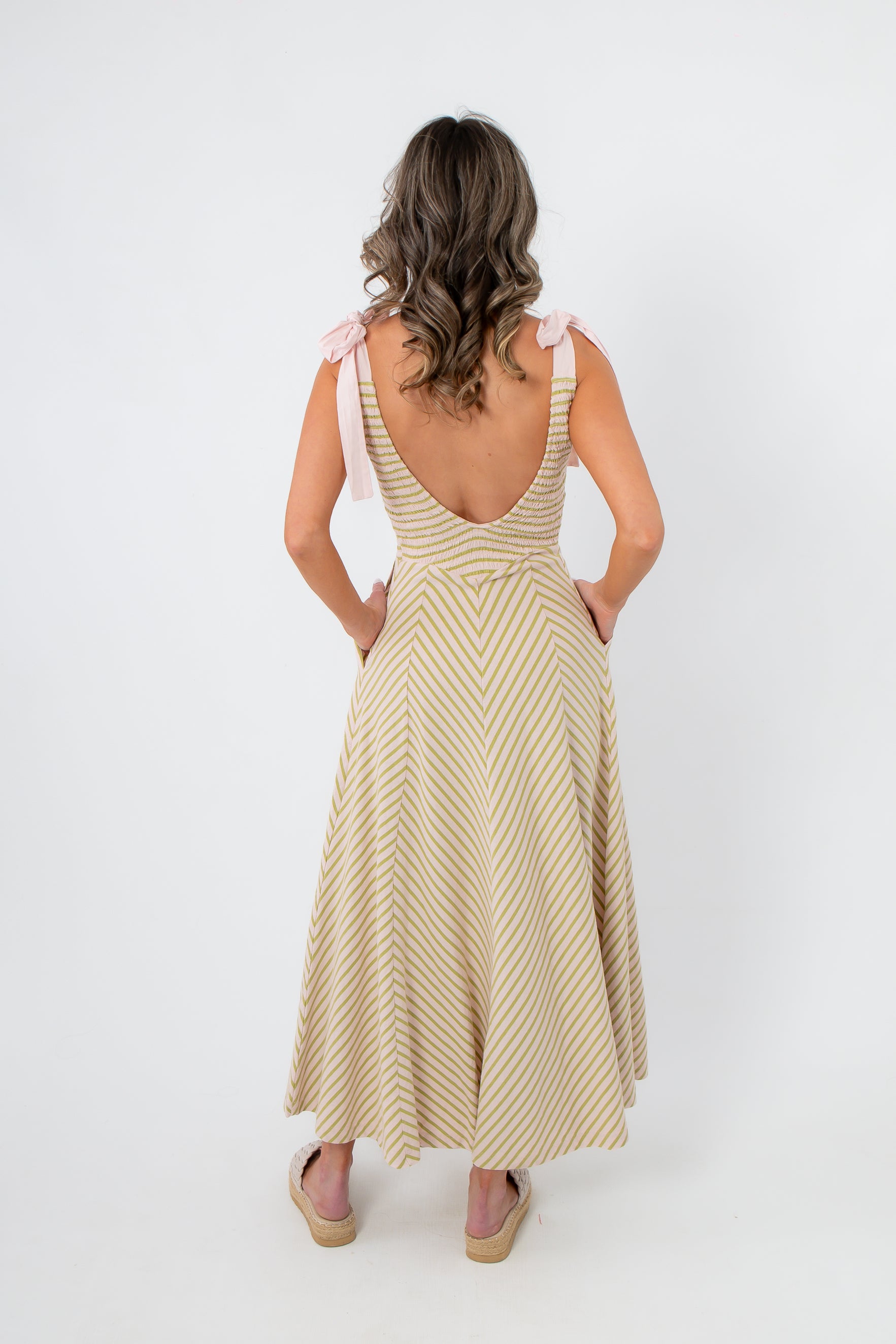 Back view of Free People Palma Cecelia Midi Dress with deep scoop back and chevron stripe design, ideal for breezy summer styling.