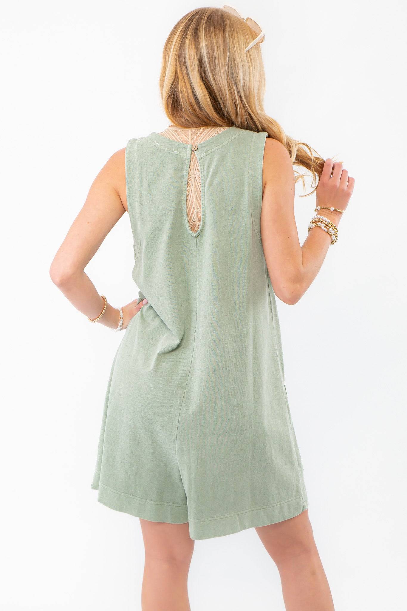 Back view of the sage green tank romper with a keyhole detail, offering a stylish and breathable design for warm-weather wear.