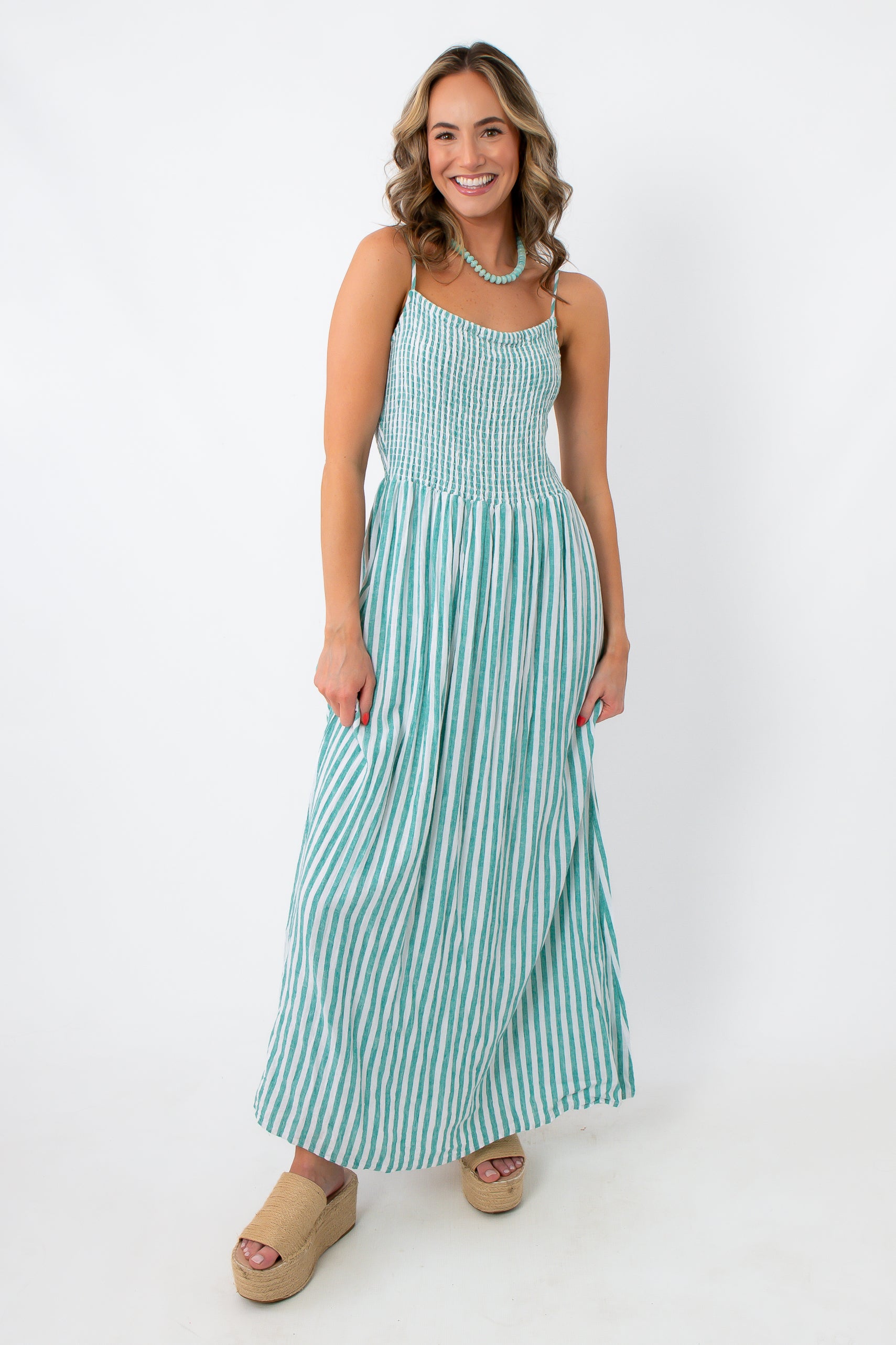 Turquoise striped midi dress with adjustable straps and flattering fit