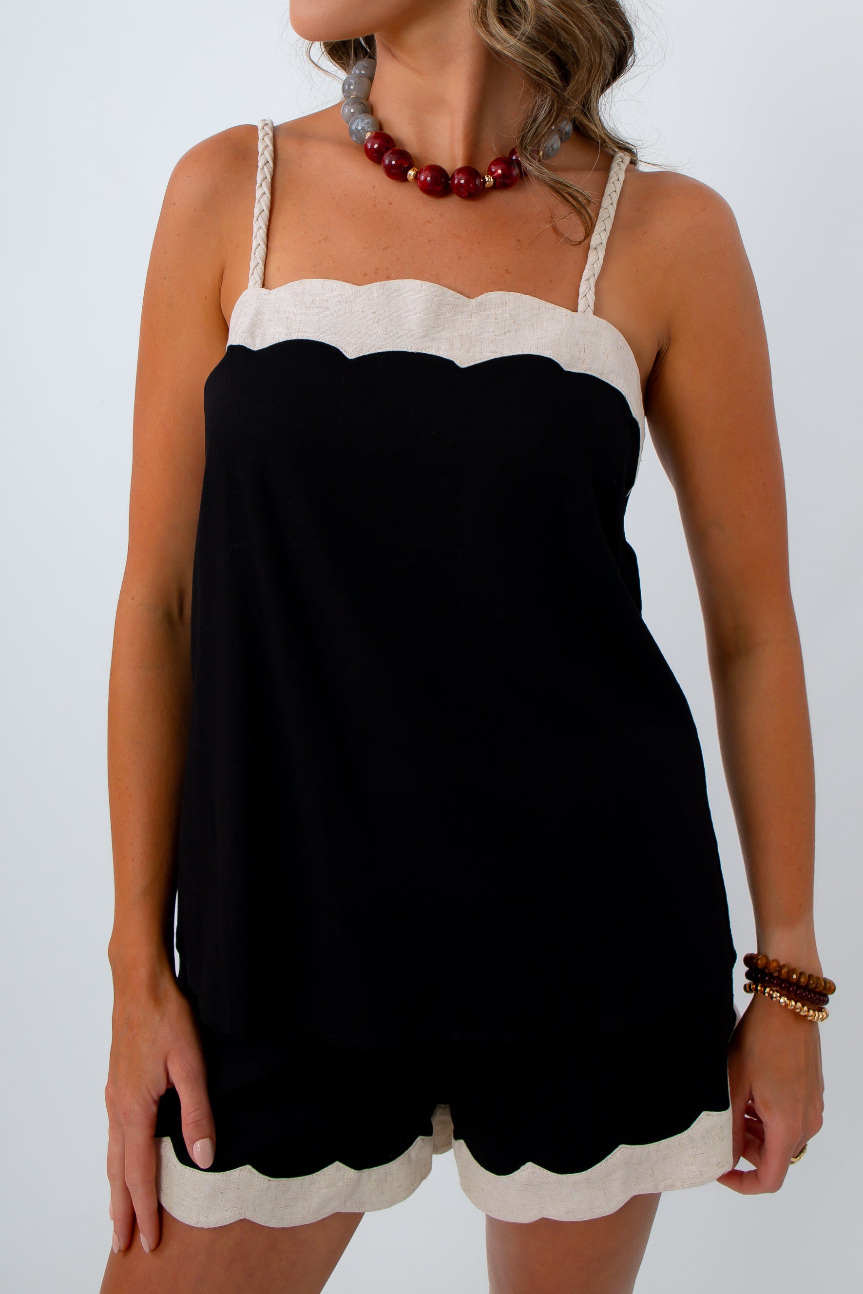 Black and cream scallop tank with adjustable straps and matching shorts for neutral game day look