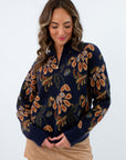 Fall sweater featuring tan floral jacquard design, navy and tan patterned sweater, navy patterned sweater
