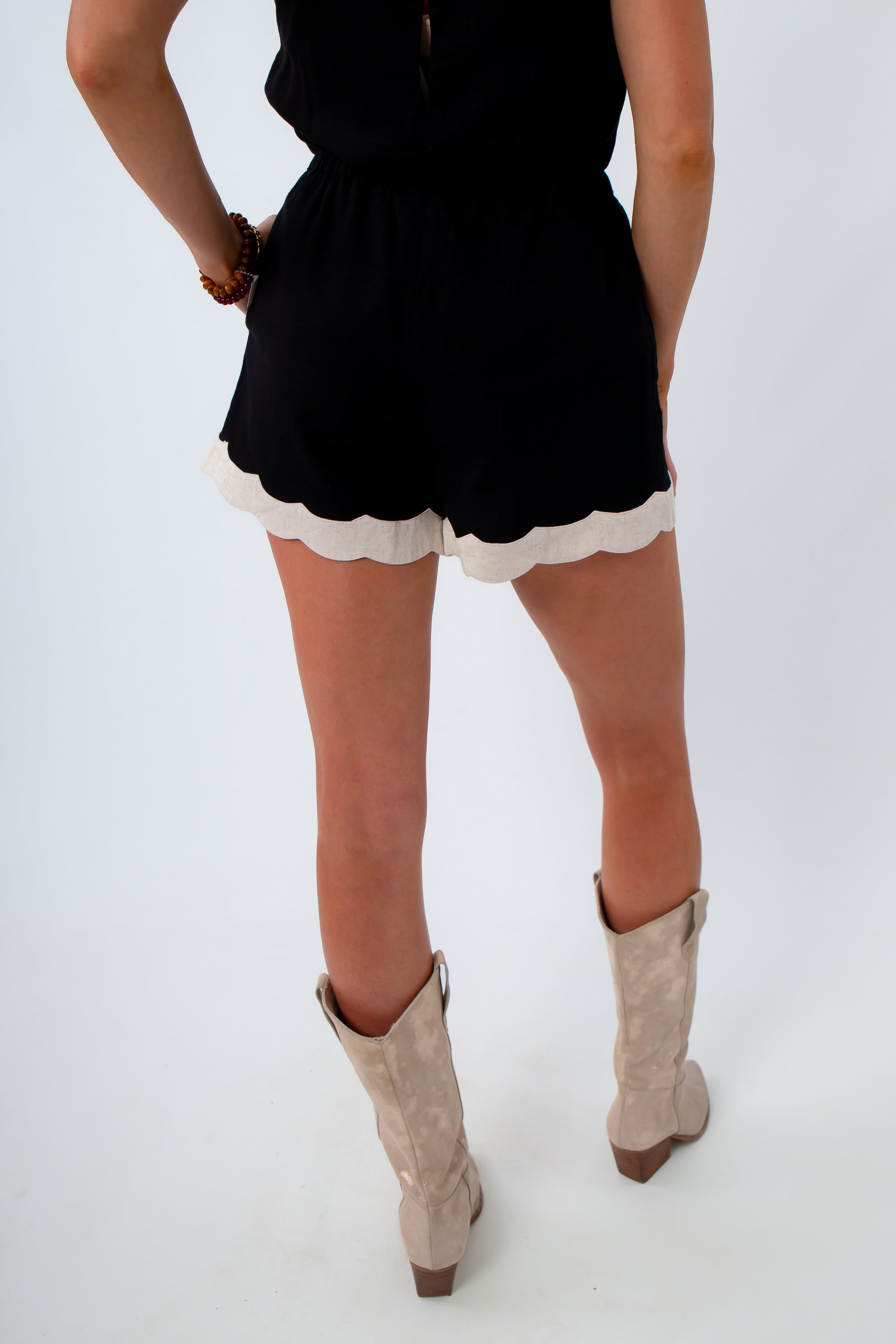 Neutral game day outfit with black and cream linen short set