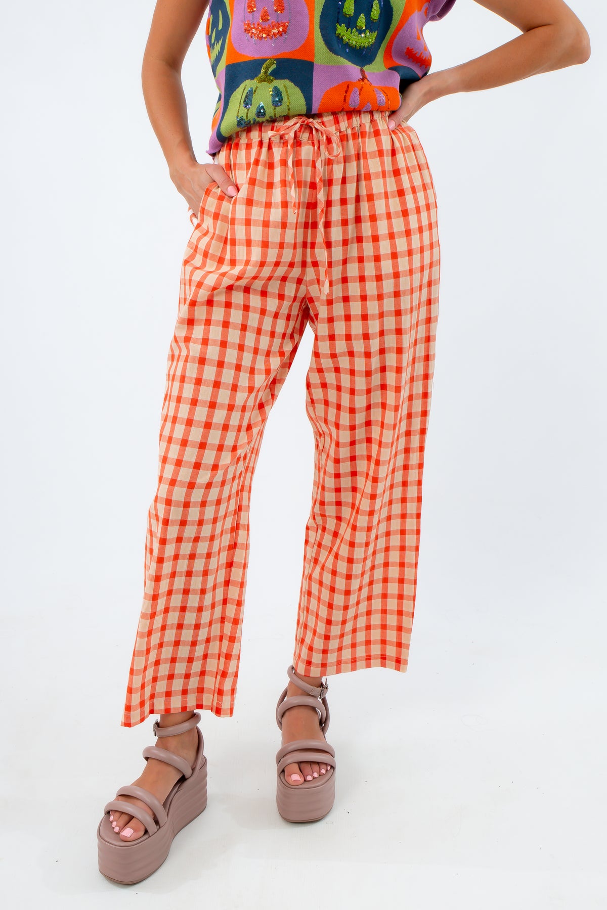 Candy Aisle Poppy gingham pants with varsity stripes, orange gingham pants with varsity stripe down the side