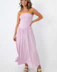 Side view of lilac ruched strapless maxi dress with flowy skirt for summer events