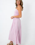 Model wearing lilac goddess strapless ruched maxi dress with chunky heels