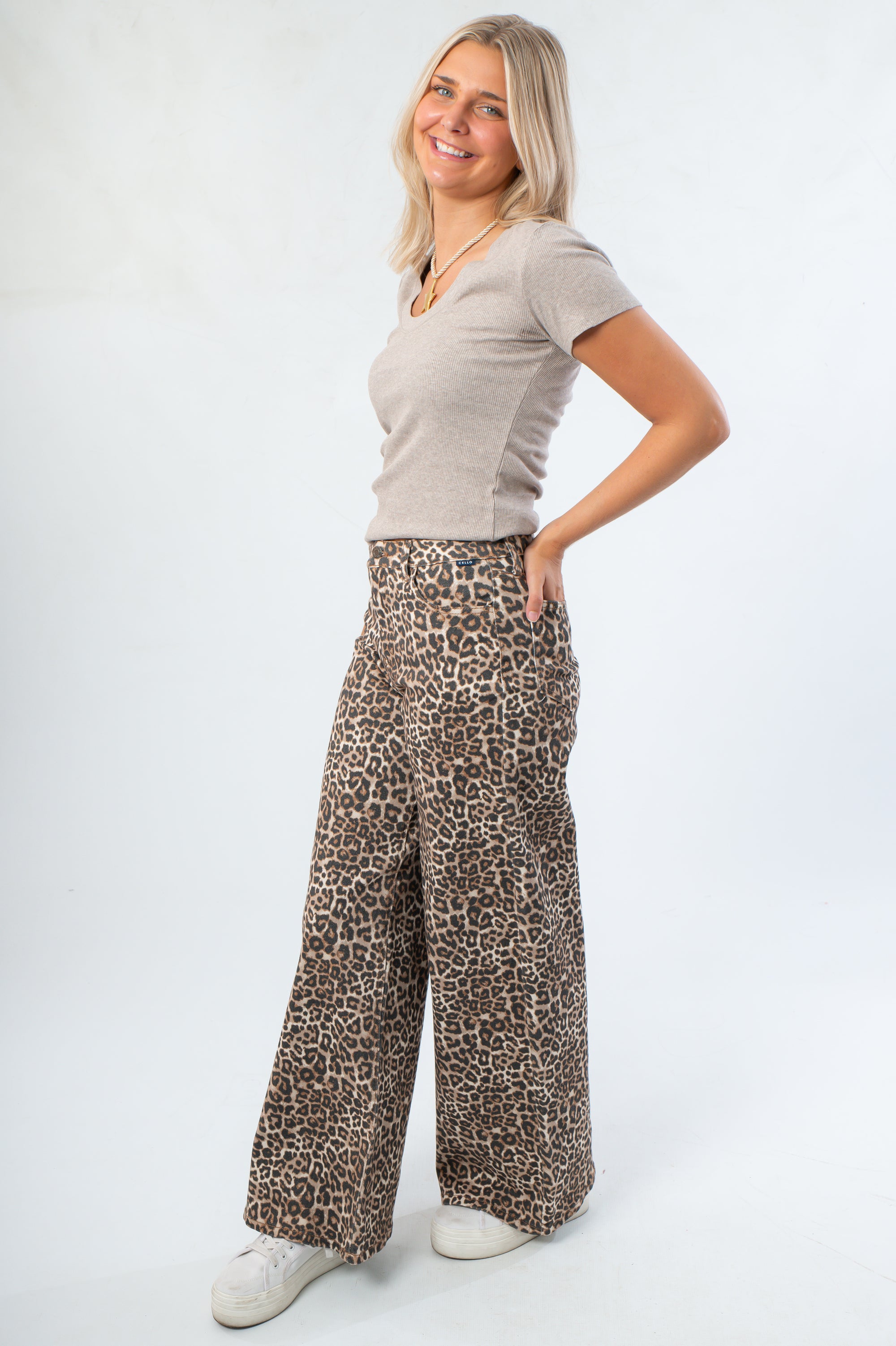 Side view of Z Supply Heather Taupe Sirena Rib Tee highlighting its slim fit and soft ribbed texture, styled with printed lounge pants.