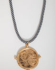 USC Gamecock gold pendant necklace featuring a corded black and white rope, ideal for fans seeking stylish gameday accessories.