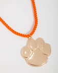 Go Team Gold Clemson Paw Corded Rope Necklace with bold gold paw pendant on bright orange twisted cord, ideal for Clemson Tigers gameday jewelry.