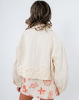 Seagarden Appliqué Floral Detail Jacket in ecru with intricate floral appliqué along the back hem, ideal lightweight spring outerwear for women.
