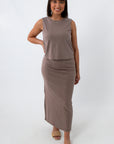 Front view of taupe midi skirt with slit and fitted silhouette