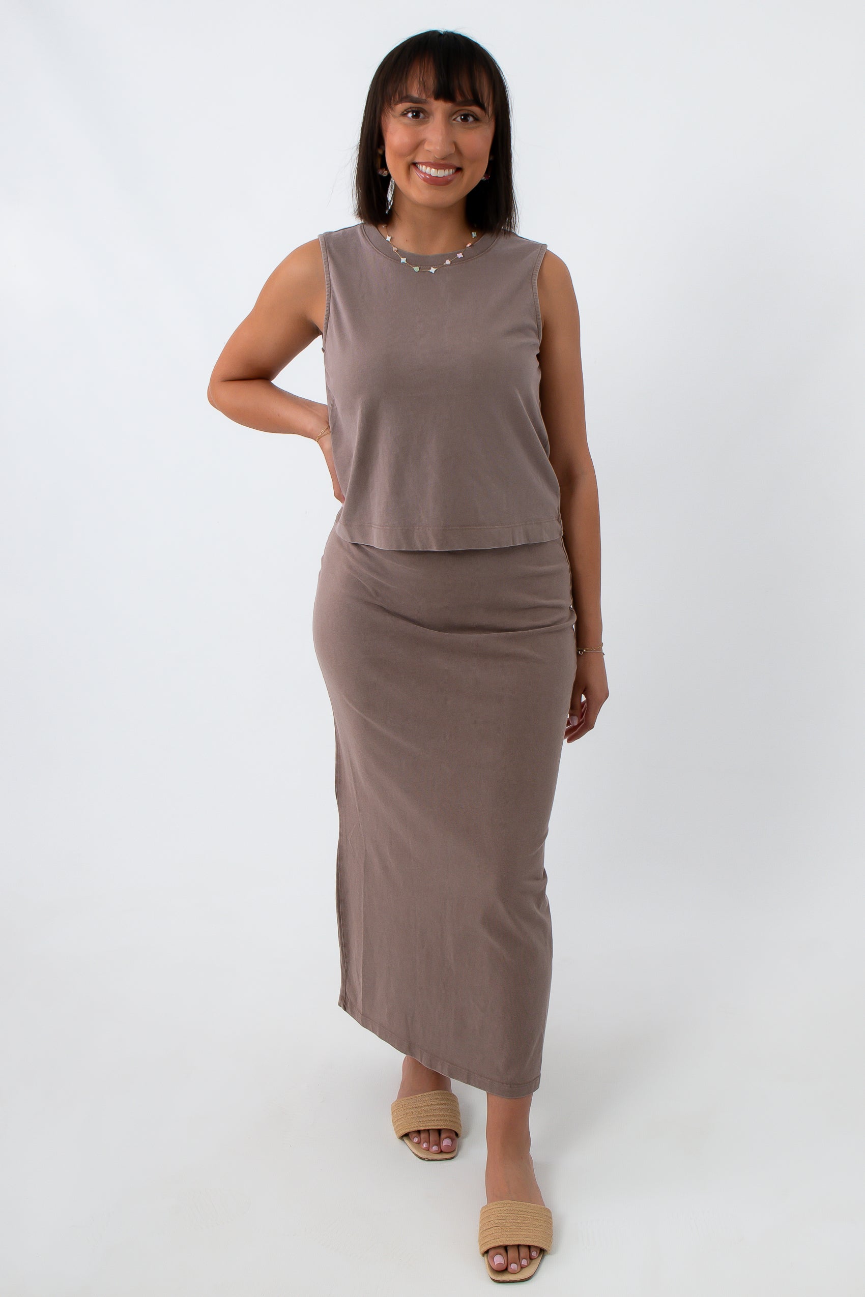 woman in taupe sleeveless tank top, back view with hairstyle