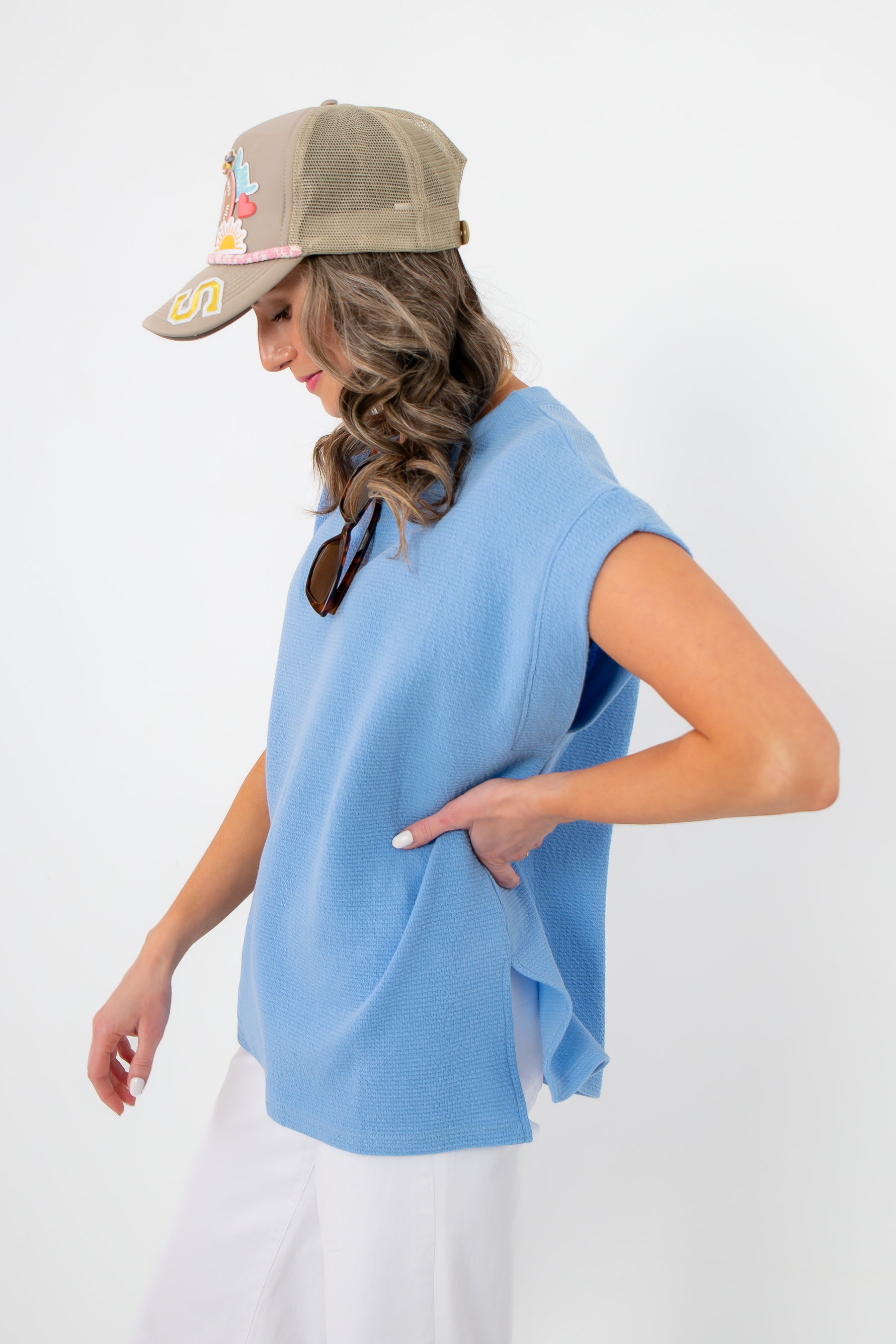 Side view of Camila Powder Blue Knit Top showing side slit detail and relaxed fit, perfect for layering or standalone spring looks.