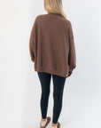 Back view of Camden Brown Ribbed Knit Mockneck Top highlighting oversized drape and ribbed knit fabric for a relaxed lounge style.