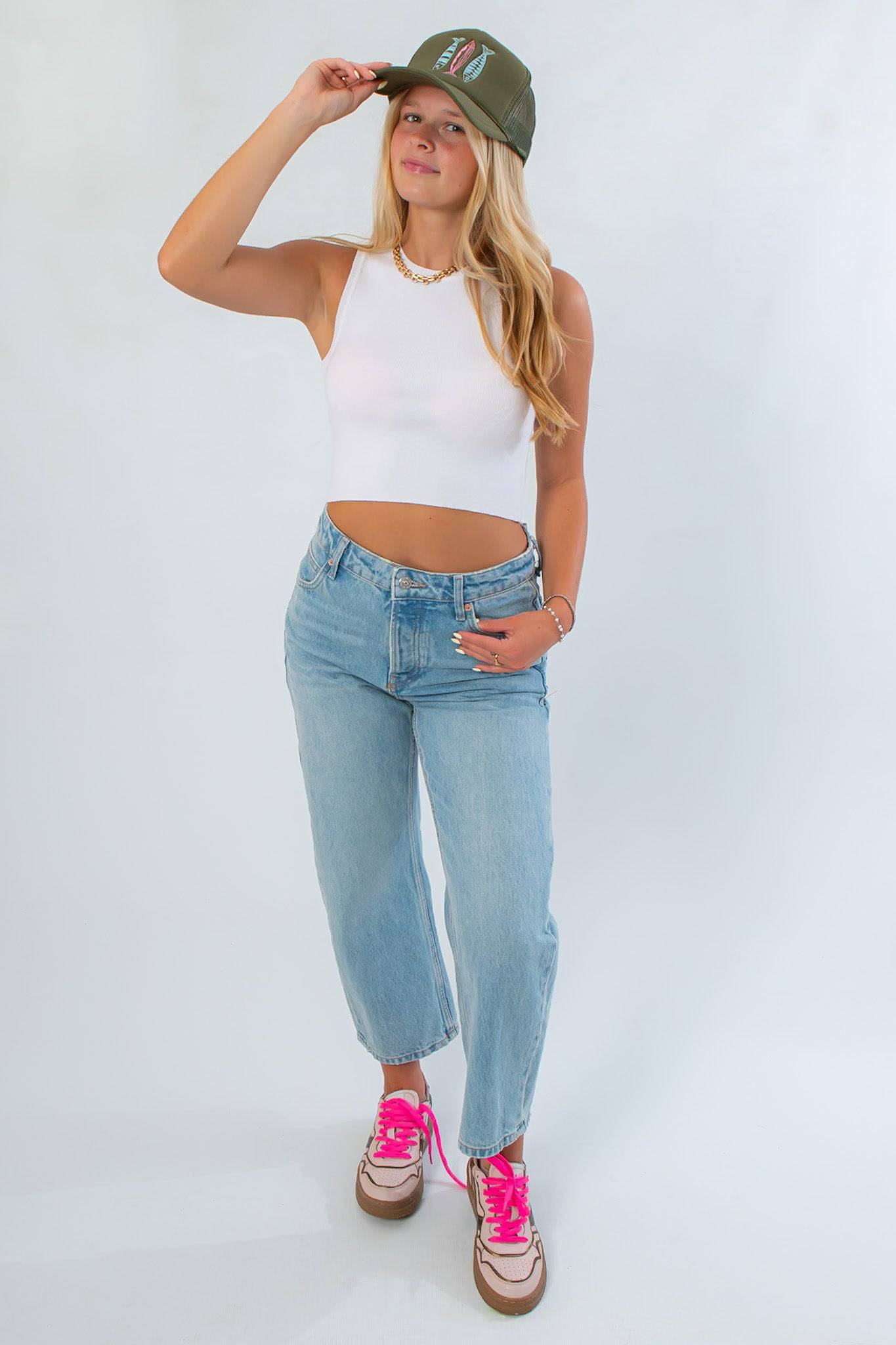 Off White Knit Tank Top – Stylish All-Season Crop Top styled with high-rise jeans and sneakers, perfect for layering or wearing solo.