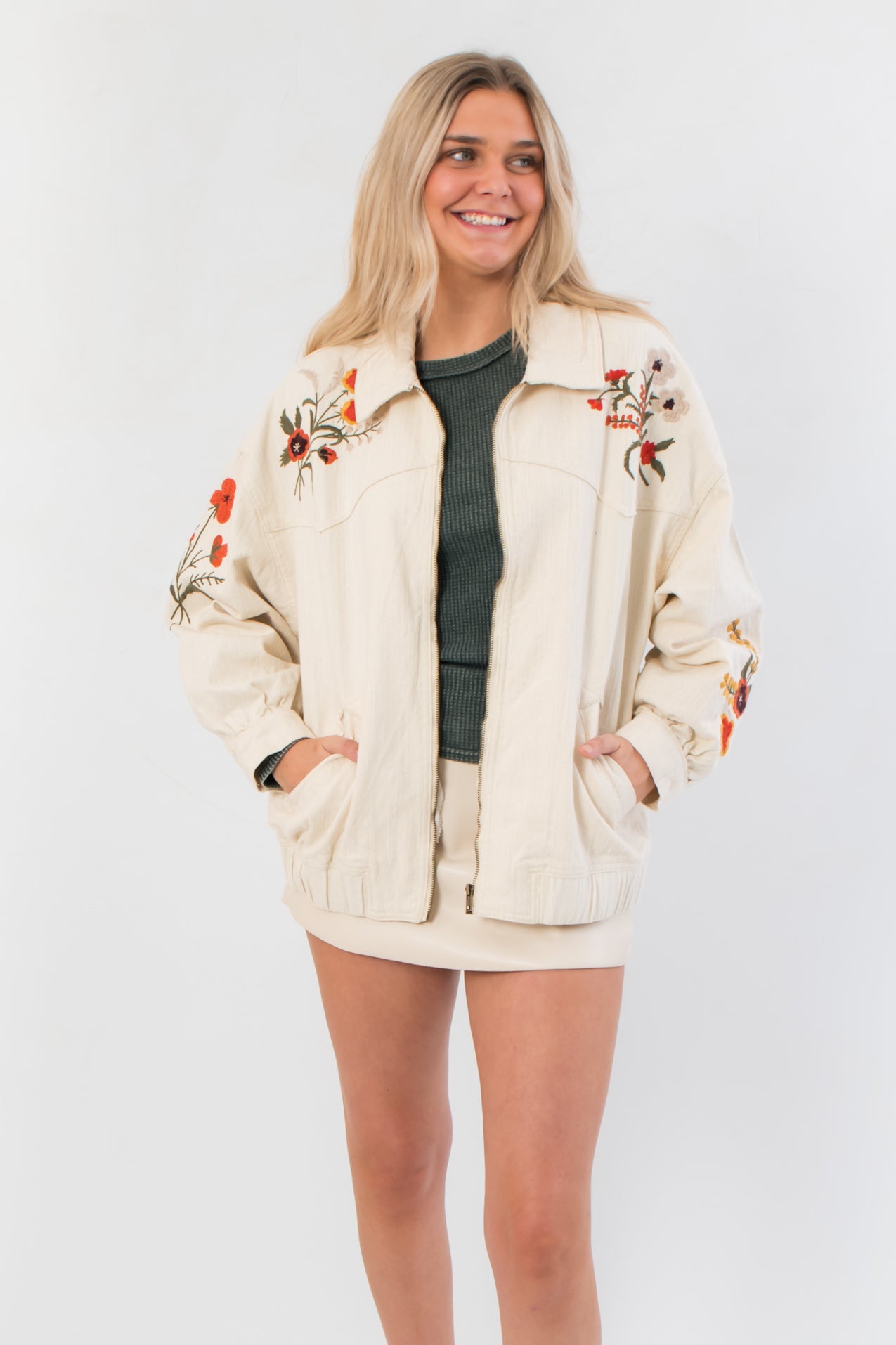 Autumn Blooms Cream Embroidered Denim Jacket with oversized fit and floral embroidery on front and sleeves, ideal for fall outerwear styling.