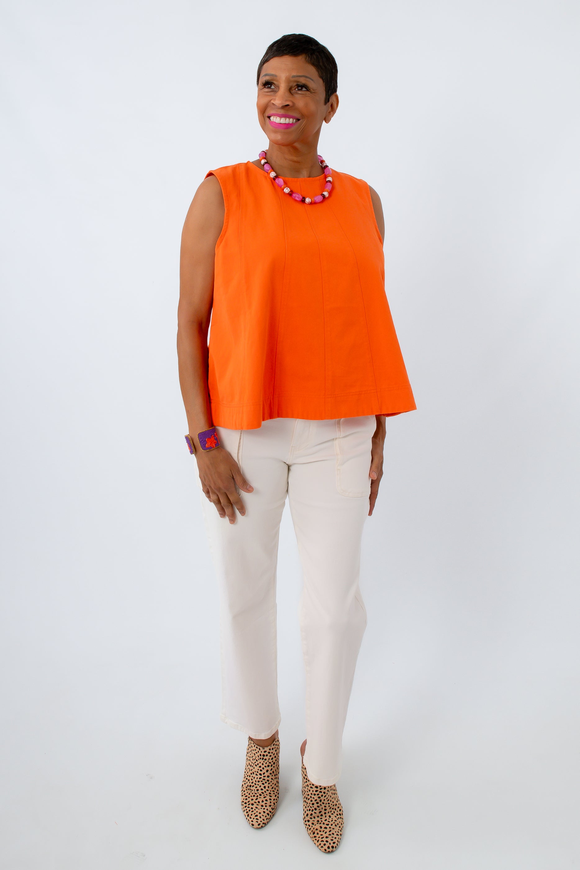 Clemson game day outfits for women featuring an orange denim top with white pants