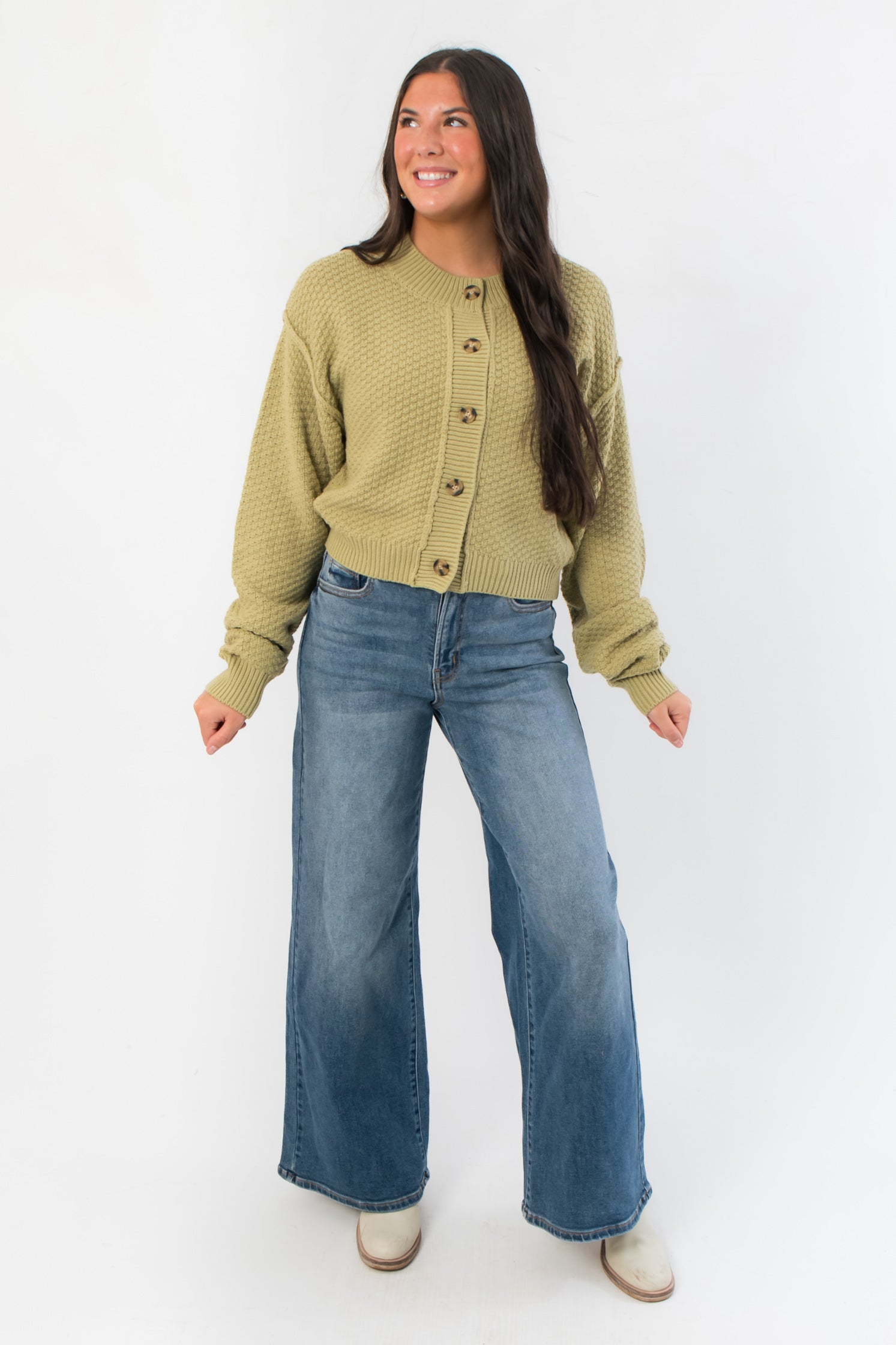 Free People Whispering Willow Lila Cardigan styled with casual denim, featuring long sleeves and a soft, textured finish.