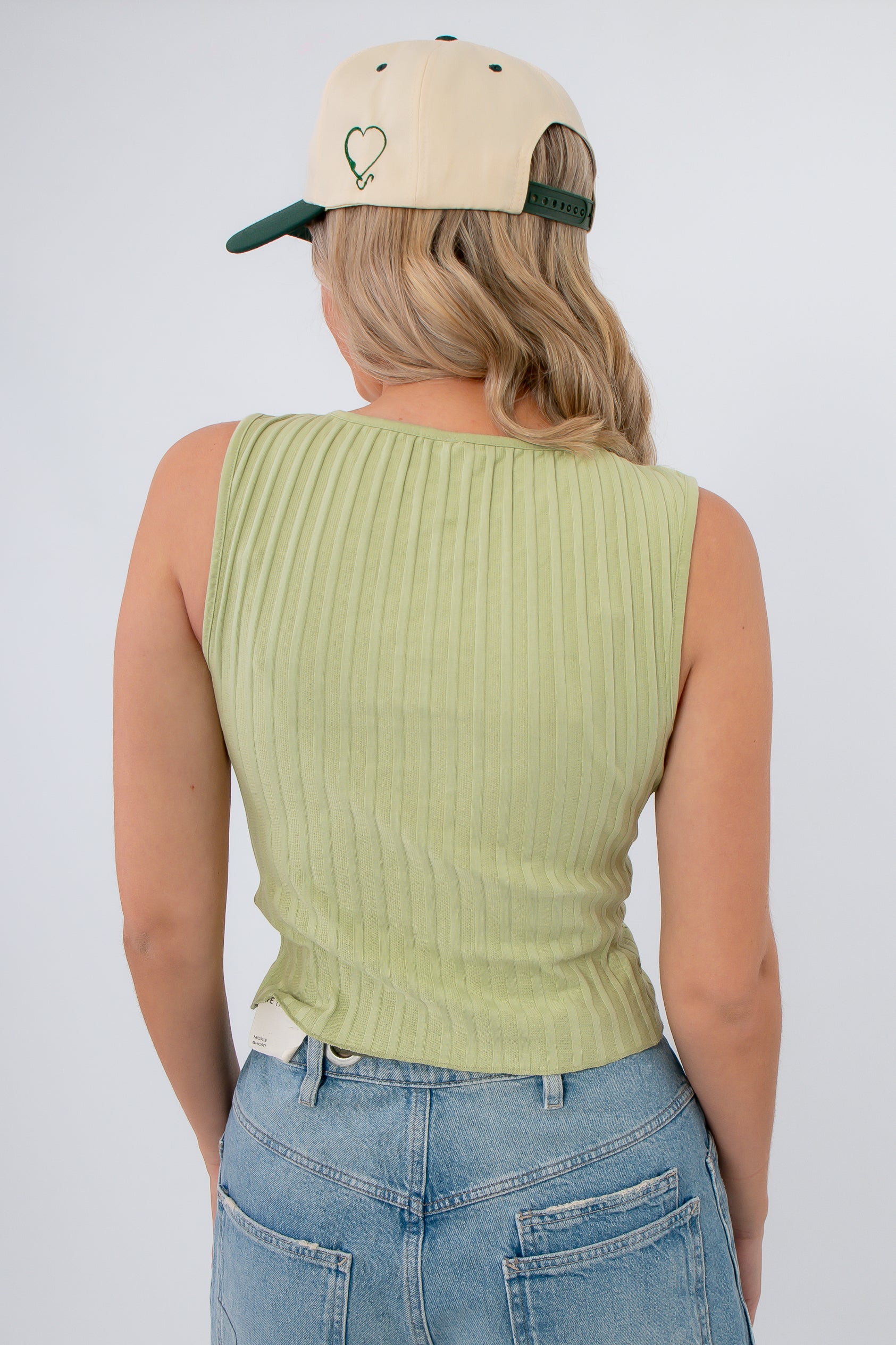 Back view of Free People Weeping Willow Tilly Vest highlighting ribbed fabric and seamless fit, perfect for boho-inspired spring outfits.