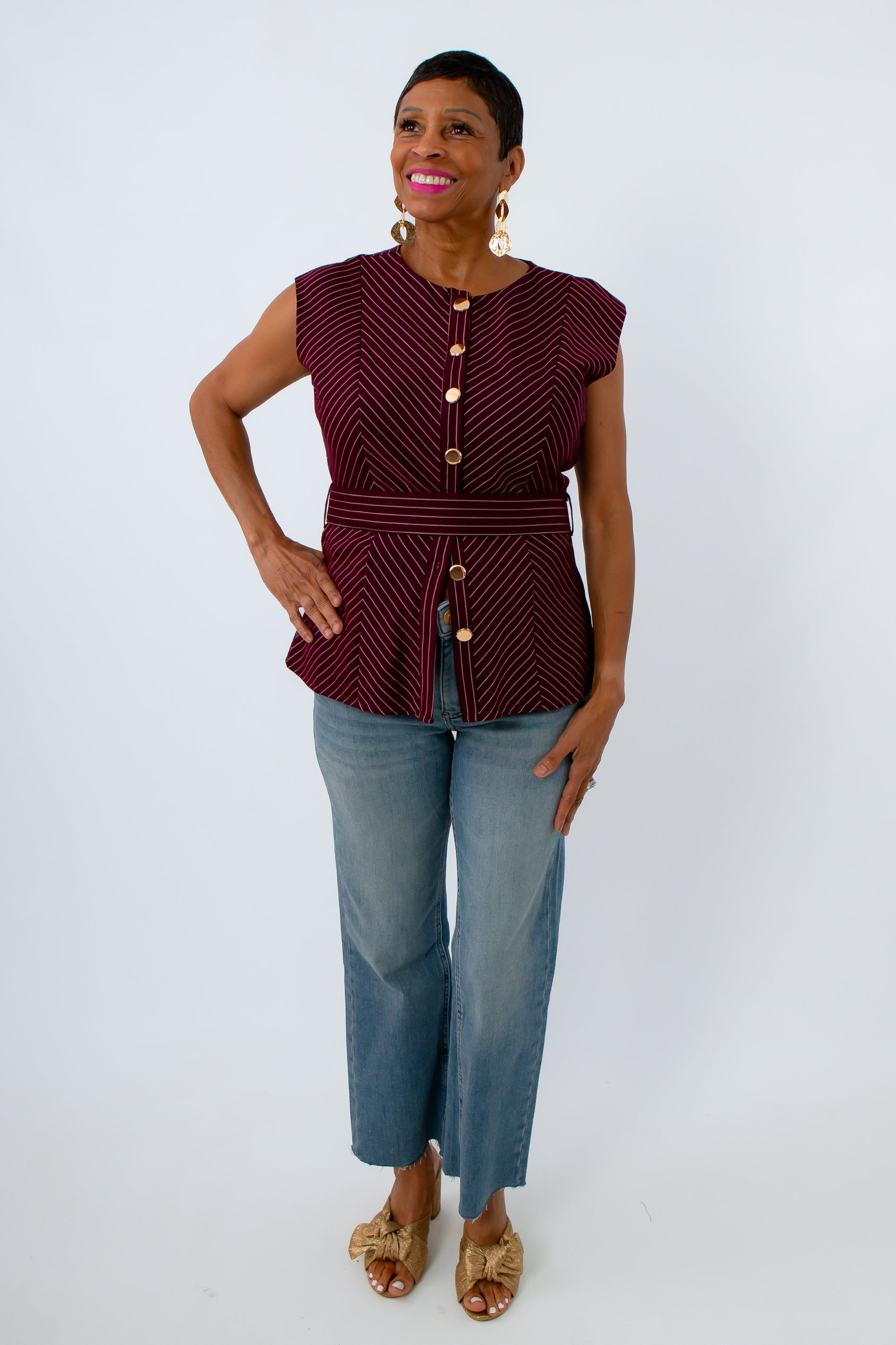 Burgundy and white striped sleeveless blouse with waist belt, perfect for fall fall workwear