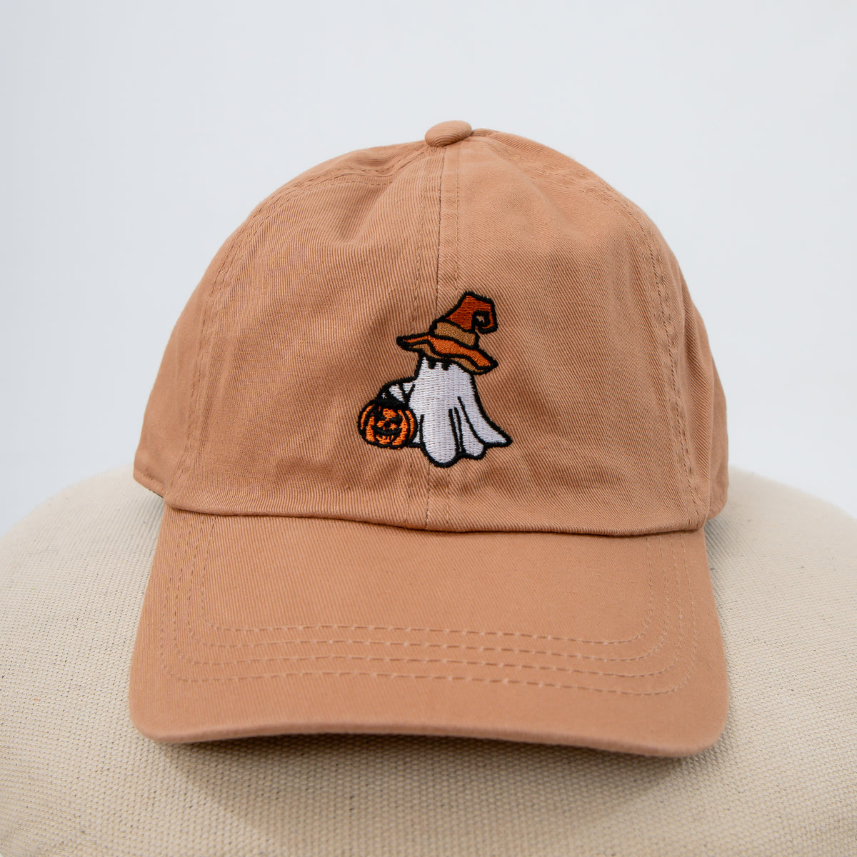 Clay colored baseball hat with embroidered ghost trick or treating, Halloween baseball cap with ghost and trick or treating design