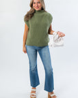 Versatile THML Green Turtleneck Ribbed Sweater Vest paired with flared jeans and platform sandals, ideal for chic autumn outfits.