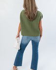 Back view of THML Green Turtleneck Ribbed Sweater Vest showing its loose silhouette and textured knit, a stylish fall wardrobe essential.
