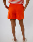 Clemson game day outfit for women with orange denim shorts and orange and white striped tank