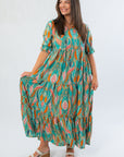 Mahi Maxi Dress in sea foam green with puff sleeves and tiered skirt, featuring a vibrant patterned design ideal for summer occasions.