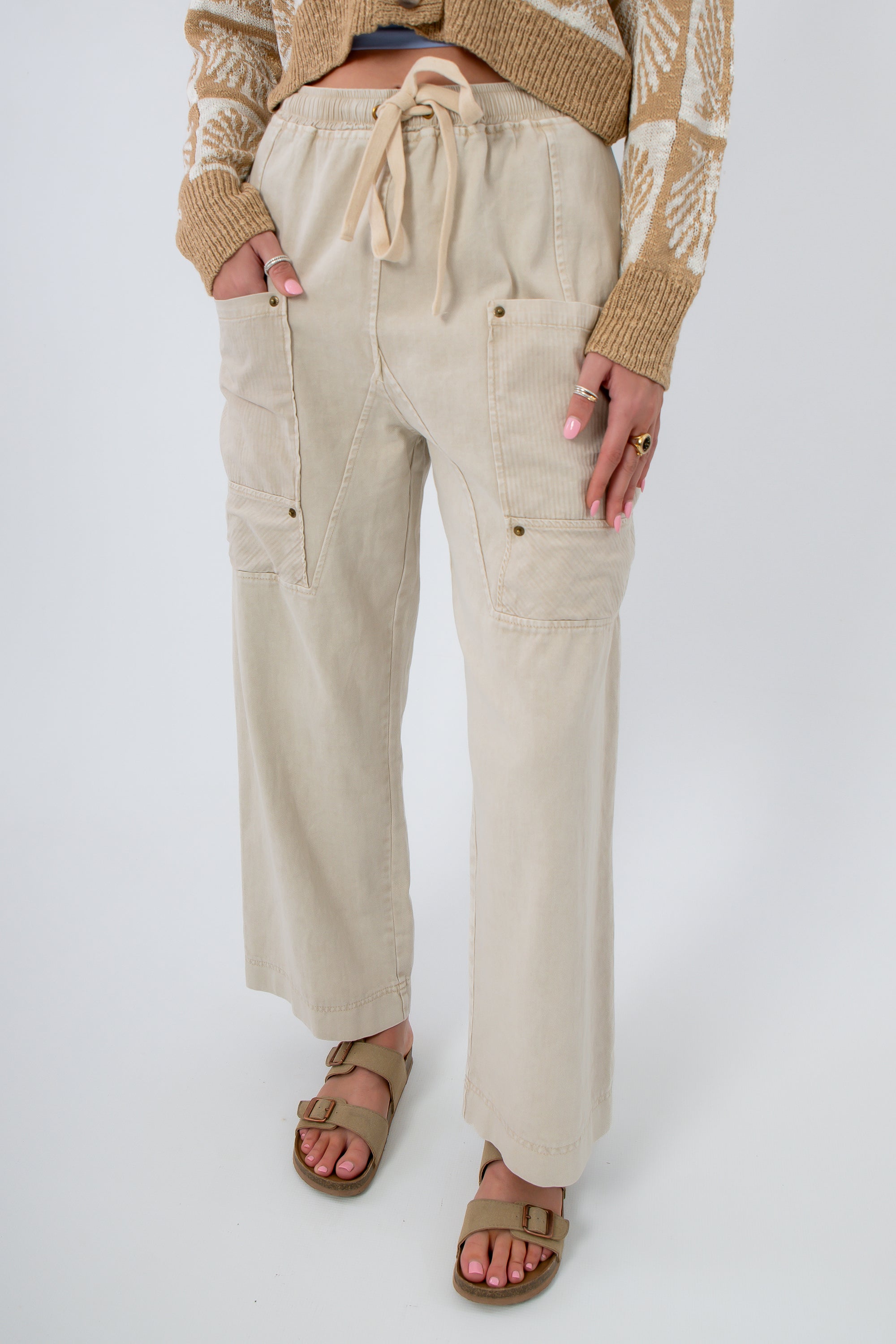 Breezy Natural Linen Cargo Pocket Pants with drawstring waist and wide leg fit, featuring front patch pockets and neutral beige tone.