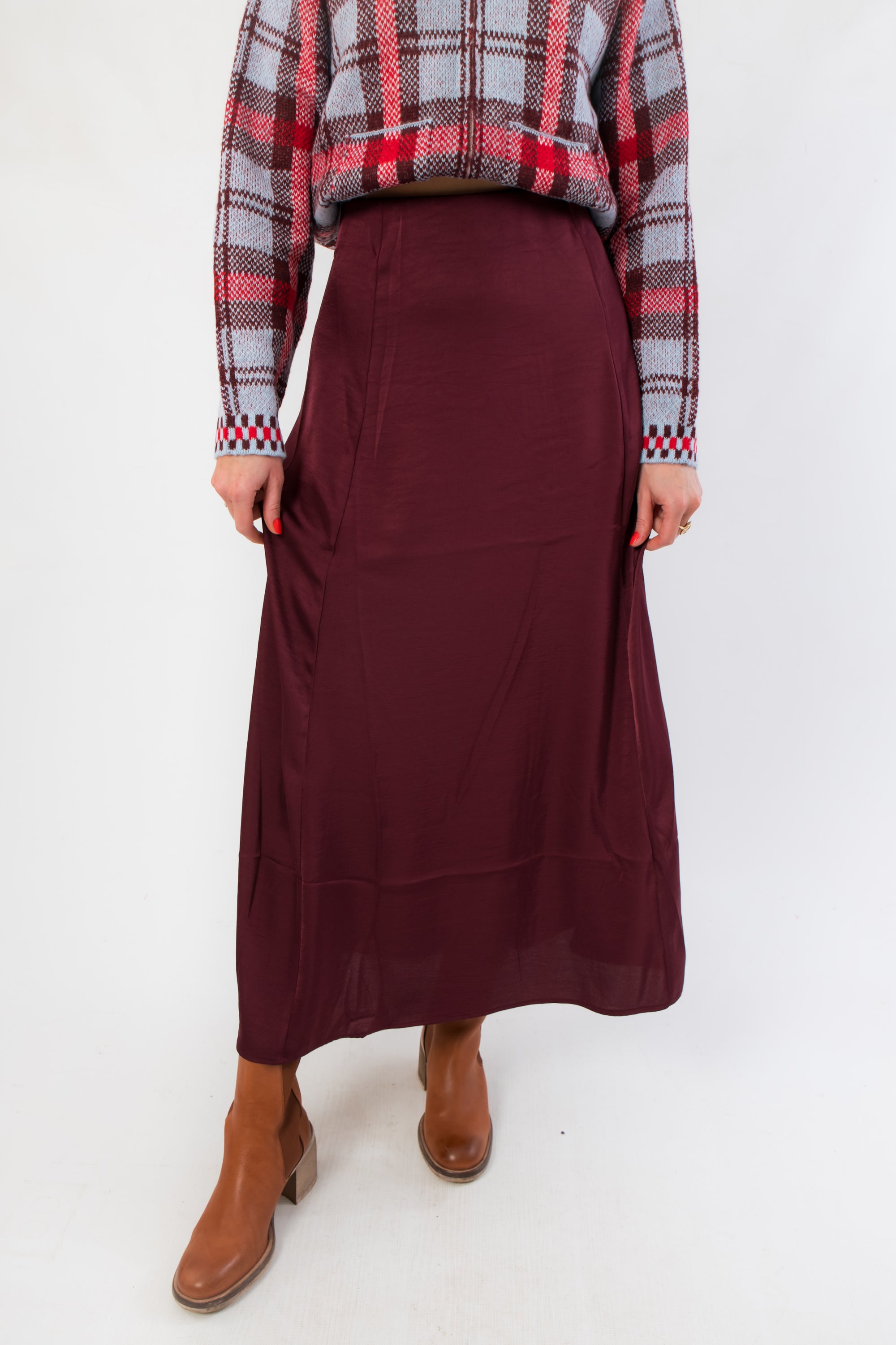 Z Supply Merlot Northpointe Satin Midi Skirt in a rich burgundy hue, styled with a plaid sweater and ankle boots for a chic seasonal look.