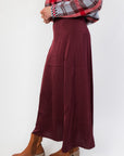 Close-up side angle of the Z Supply Merlot Northpointe Satin Midi Skirt highlighting its elegant drape and flowy satin fabric.