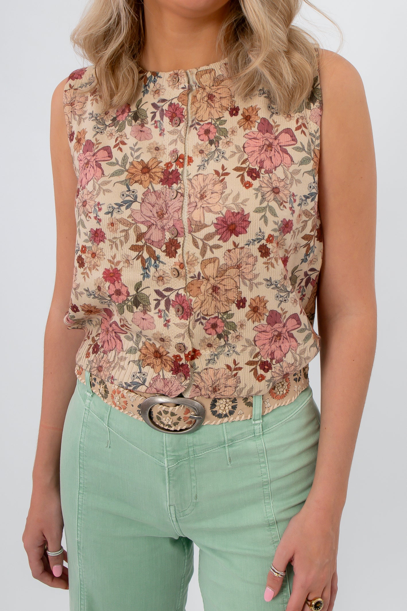 Woven boho belt styled with floral blouse and mint green pants