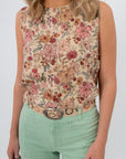Woven boho belt styled with floral blouse and mint green pants
