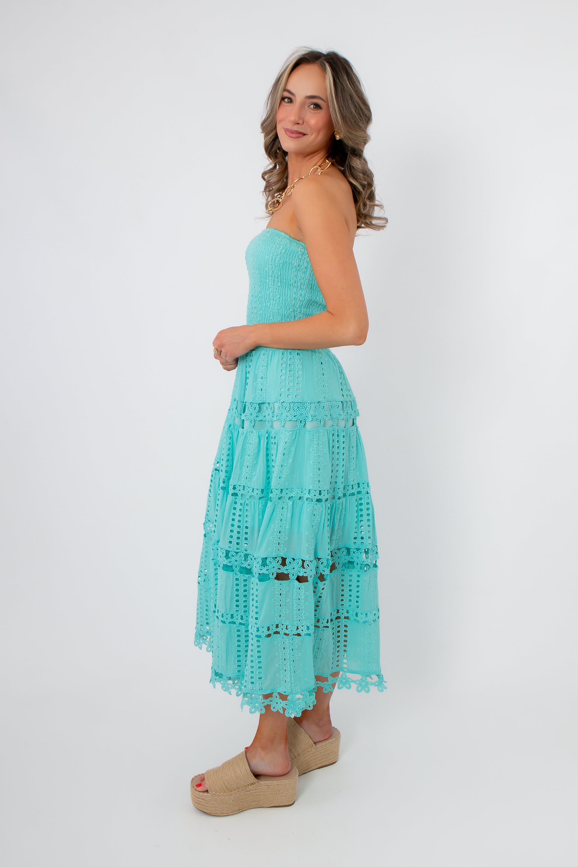 Aquamarine Moment Eyelet Lace Strapless Dress side profile highlighting the detailed eyelet lace and flattering strapless fit.