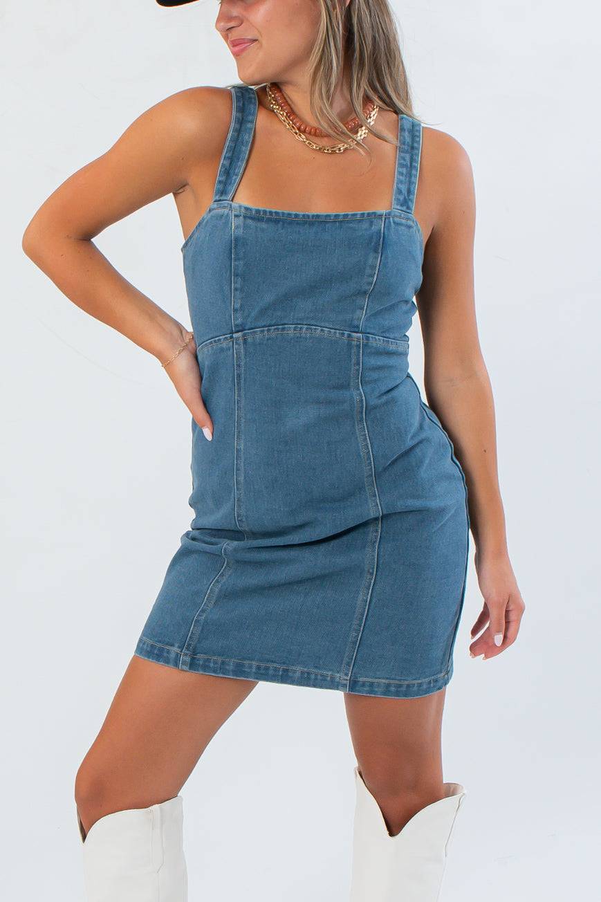 Close-up of Karli Denim Corset Back Mini Dress showing structured seams and square neckline, ideal for fall gameday outfits.