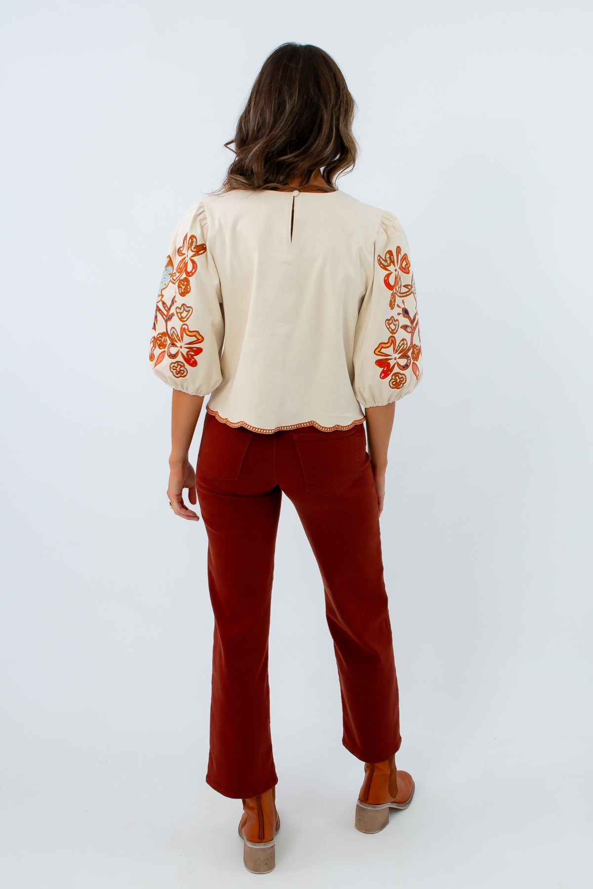 Straight leg fall jeans, stretchy jeans for fall, reddish-brown colored jeans, rust colored pants